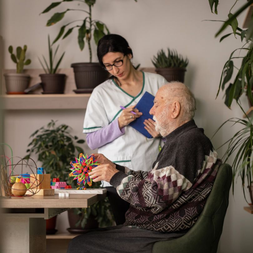 Friendly Anglesey caregiver smiling with client